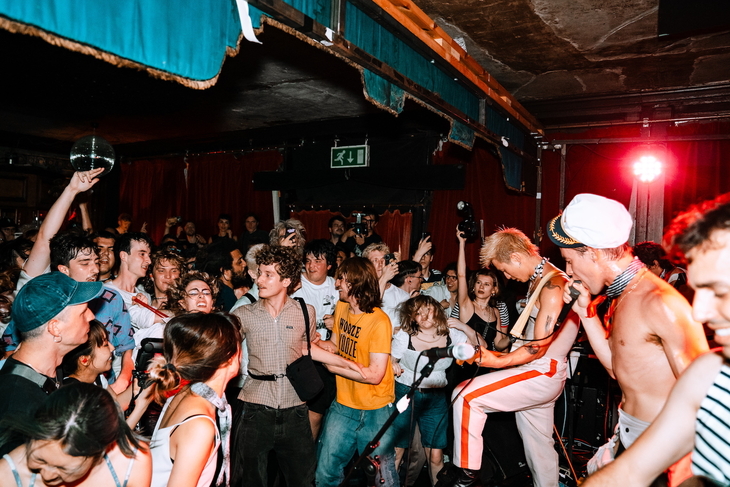 Young people being raucous at a gig