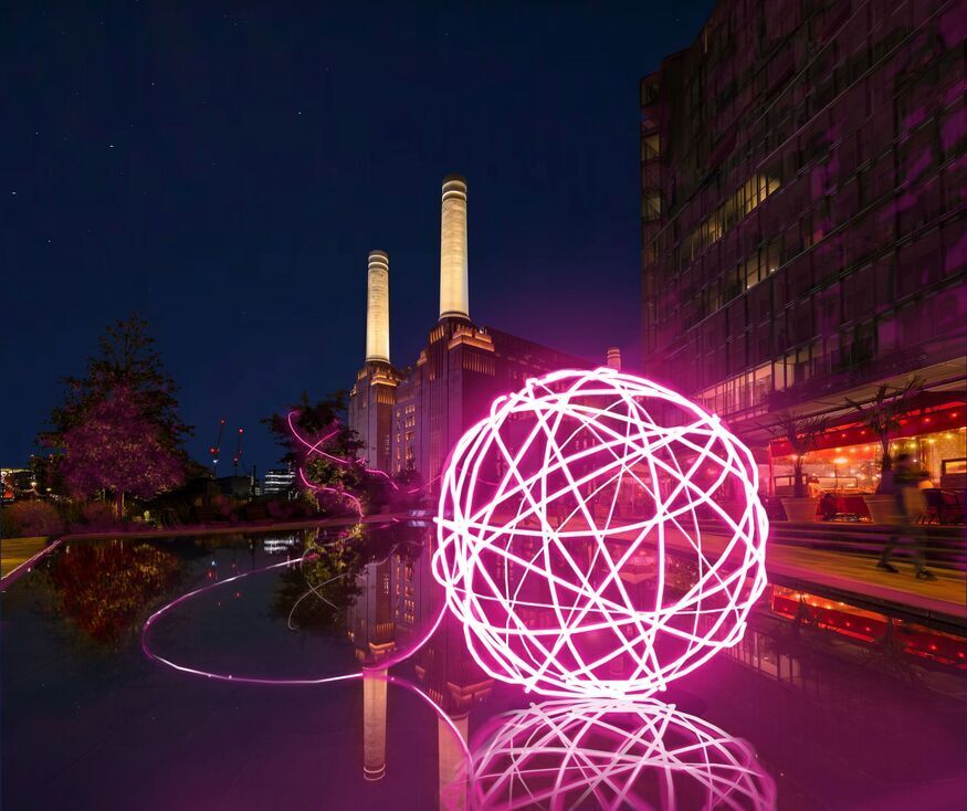 A neon ball of yarn in front of Battersea Power Station