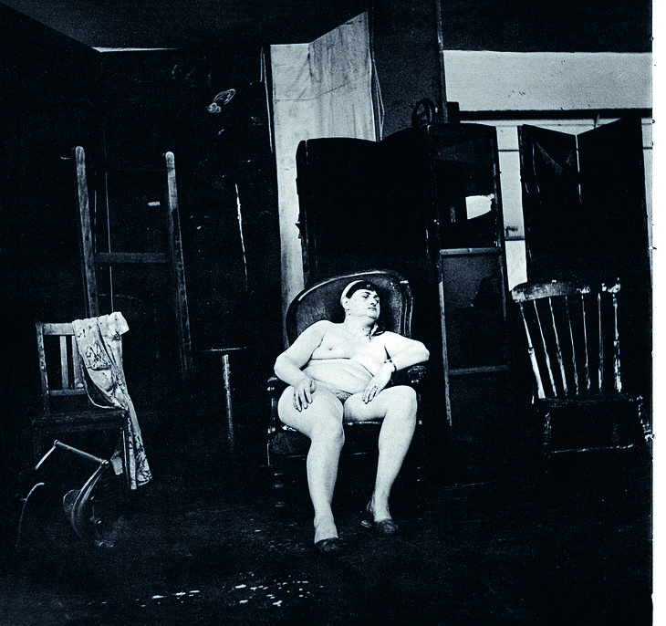 A naked woman seemingly asleep