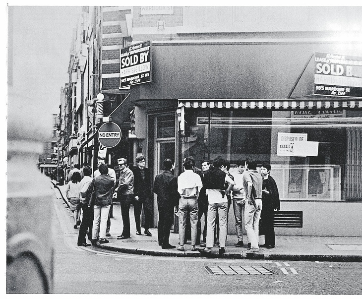 Young men hanging out on a street corner