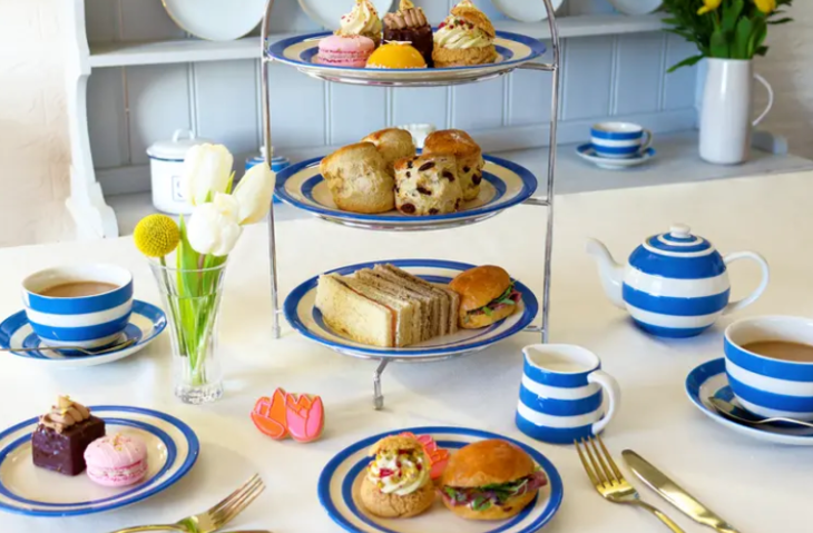 A traditional afternoon tea served on blue and white striped crockery