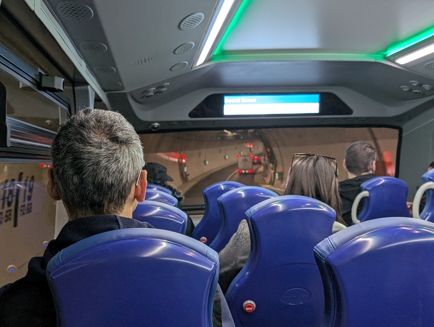 A bus full of people in the tunnel