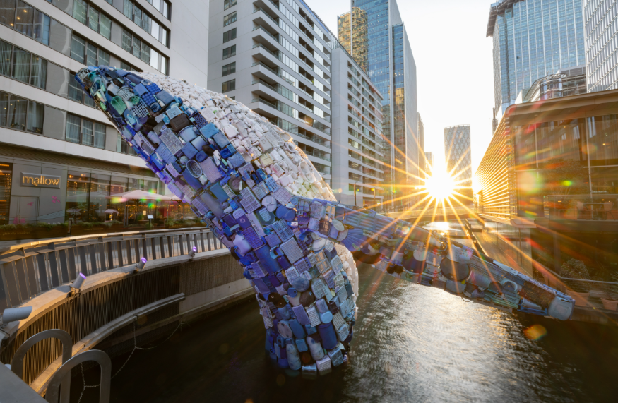 A huge plastic 'whale' leaping out of a dock