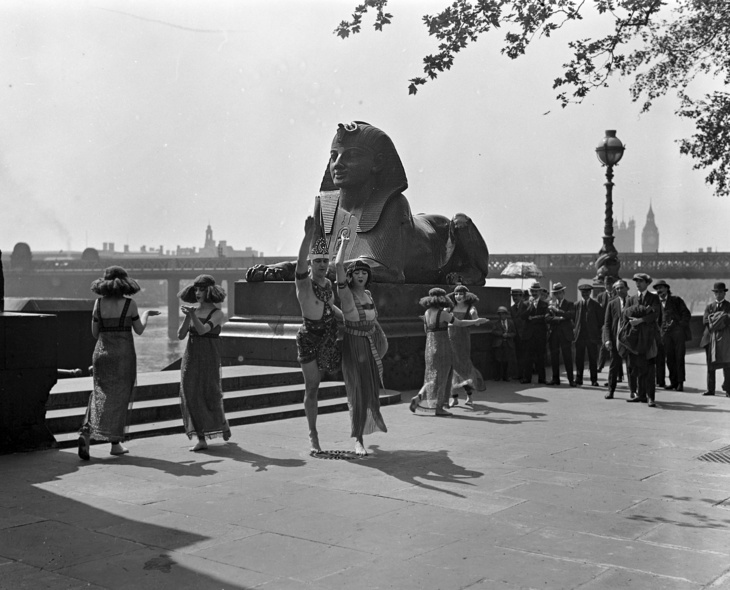 People dancing in front of sphinxes on the Embankment