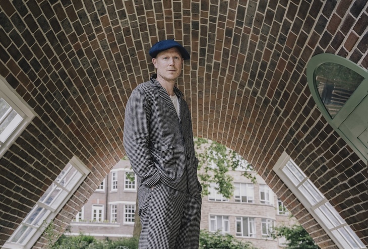 Alex Chinneck inside his 'A week at the knees' sculpture