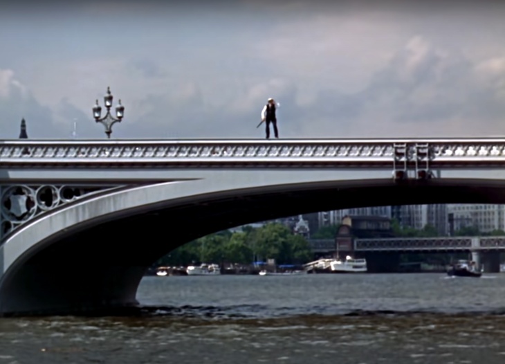 Buster Keaton (or is it) standing on the side of Westminster Bridge
