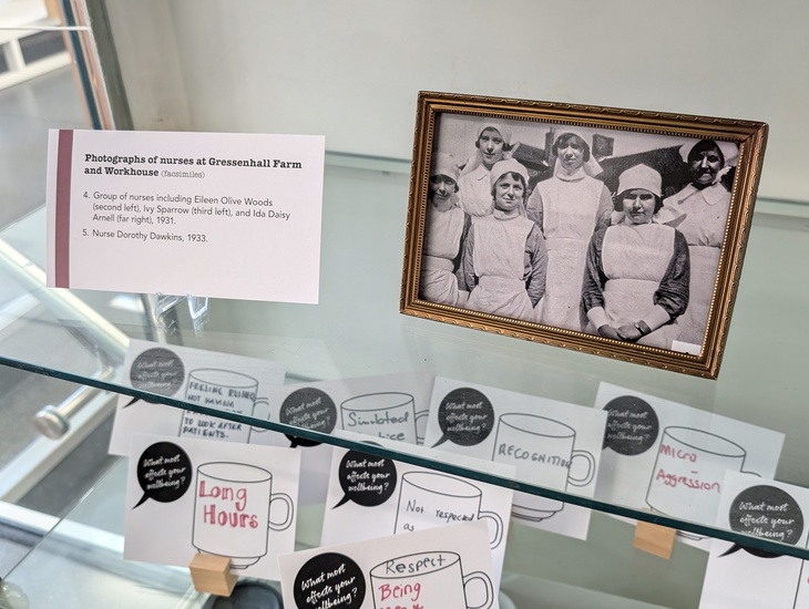A display with a photo of nurses of yesteryear