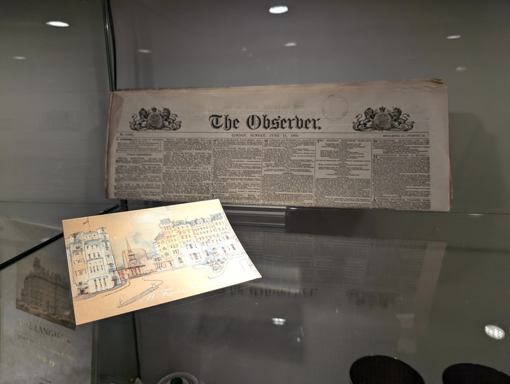 A postcard of the hotel, with a copy of the Observer newspaper from the day after it opened