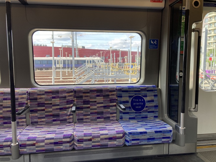 Elizabeth line moquette with a priority seat on the end