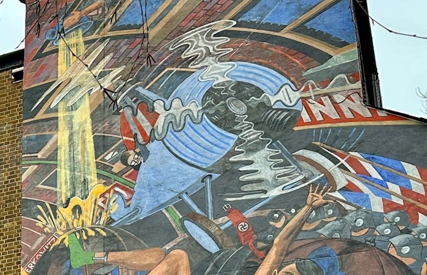 Autogrio on a mural of the battle of cable street