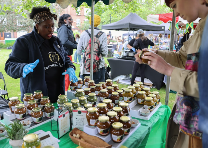 A stall with glass jars of chutney or jam