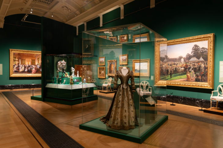 A dress on display in a glass case at the Edwardians: Age of Elegance exhibition