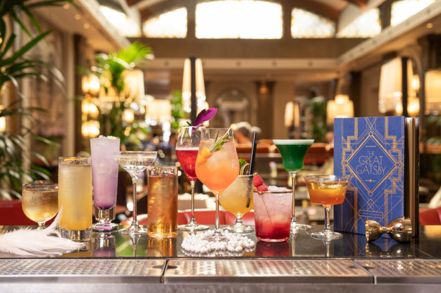 11 varied cocktails alongside a Great Gatsby menu on the bar at Sheraton Grand Park Lane