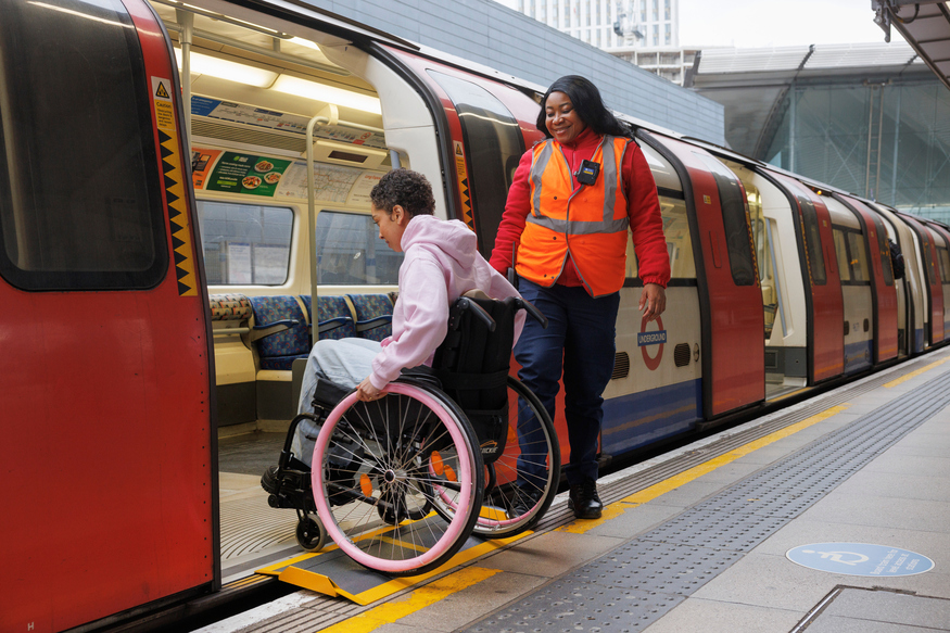 A passenger in a wheelchair boarding a Tube train