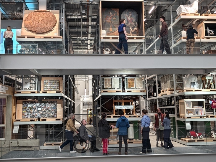 People wandering among a museum's collections