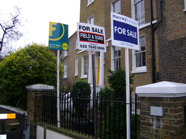 A bunch of for sale signs