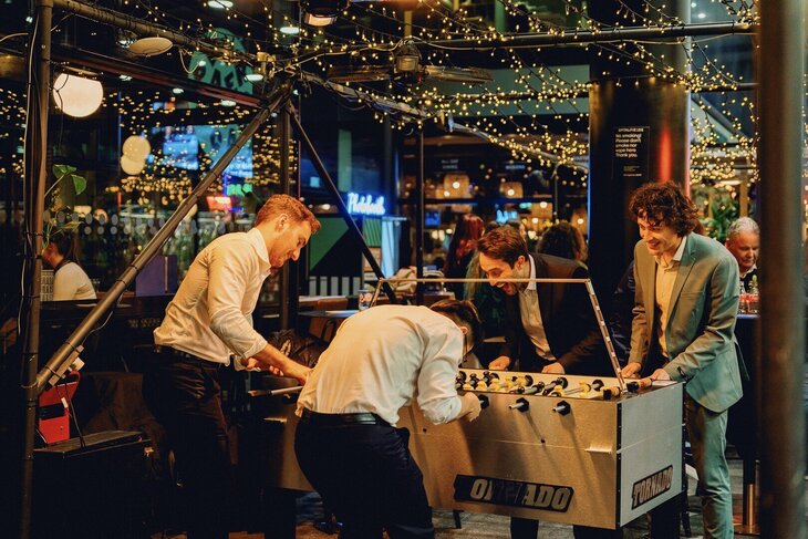 Lads playing foosball