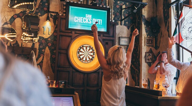 Someone winning at darts
