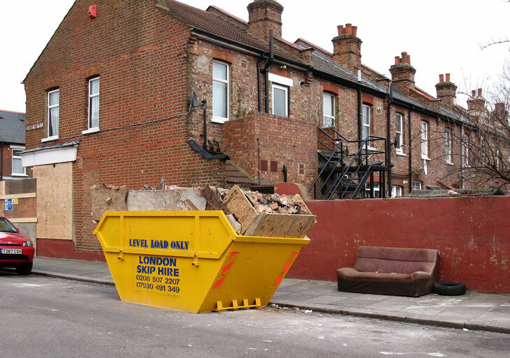 A skip outside a house