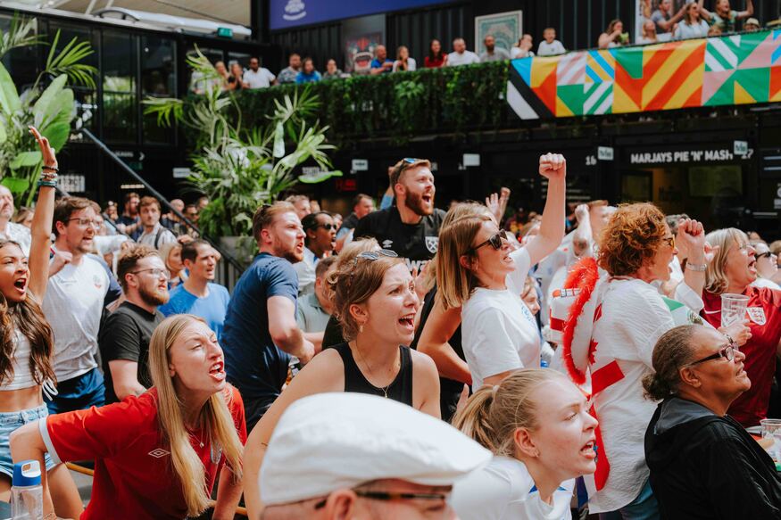 People cheering on the action