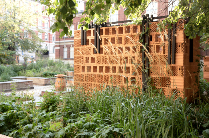What's on in London July 2025: a garden with an insect hotel wall