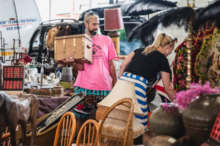 Two people browsing at a flea market