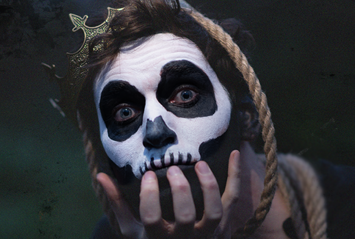An actor with face painted like a skull