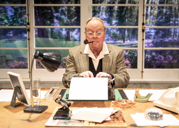 What's on in London July 2025: an actor on stage in front of a typewriter