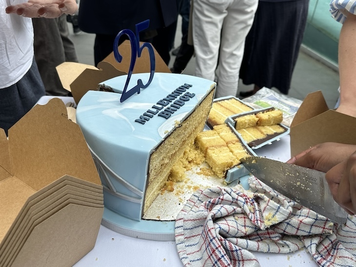 A cut cake for the millennium bridge's 25th birthday