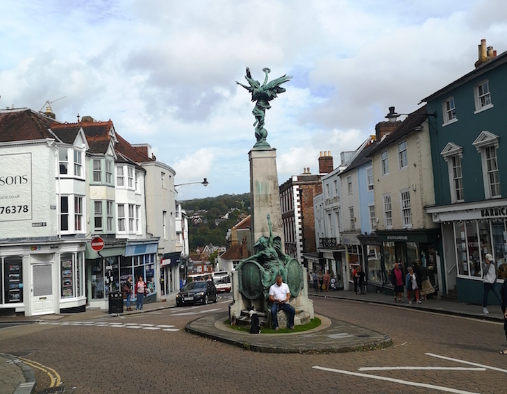 Lewes: A statue on a plinth at the middle of a junction in Lewes high street