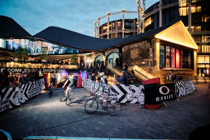 Cyclists taking part in a race through Coal Drops Yard