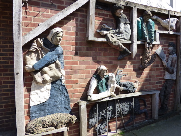 Visit Sevenoaks: 3D figures mounted on a red brick wall