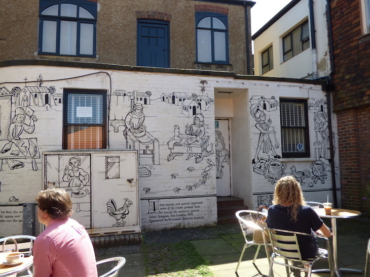 Visit Sevenoaks: a white wall decorated with black line drawings