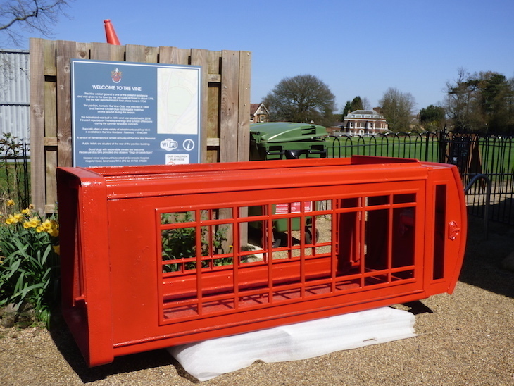 Visit Sevenoaks: a red phone box on its side after being painted recently