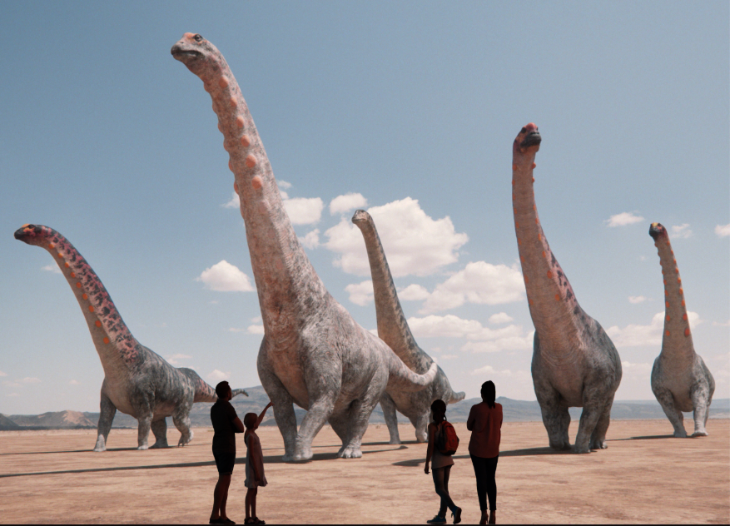What's on in London July 2025: people in front of a giant screen depicting dinosaurs
