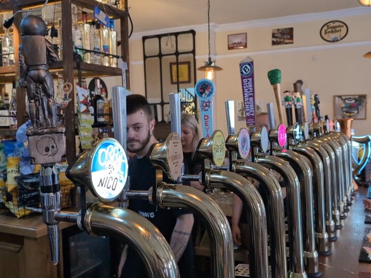 A row of beer taps