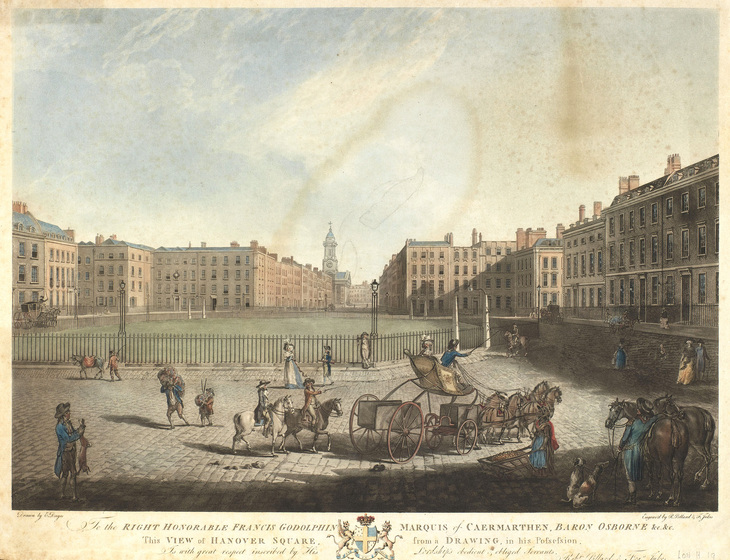 A horse being ridden around a square