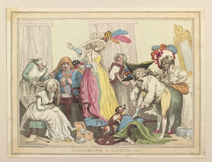 People getting ready for a masquerade