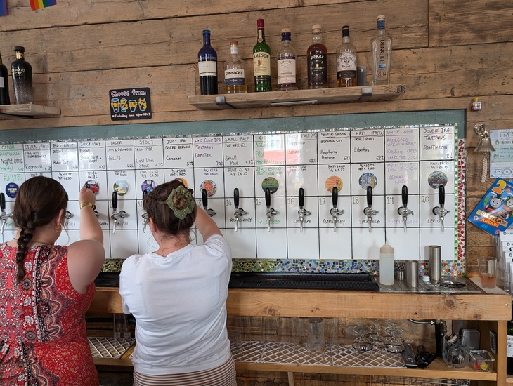 Beers being poured at the Green Goddess