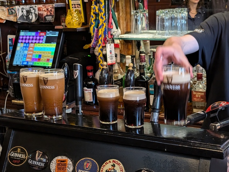 Guinnesses lined up on the bar