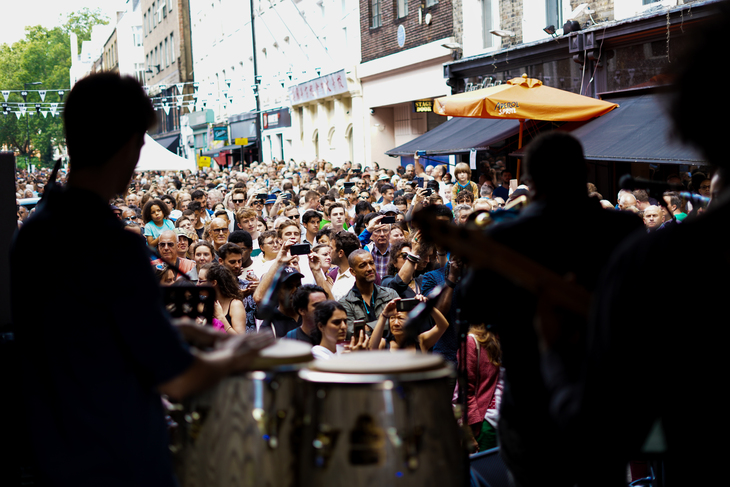 Musicians playings on s stage in the street