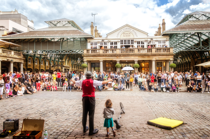 A street entertainer performing in the piazza