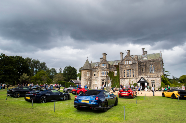 August day trips from London: supercars parked on grass in front of a manor house