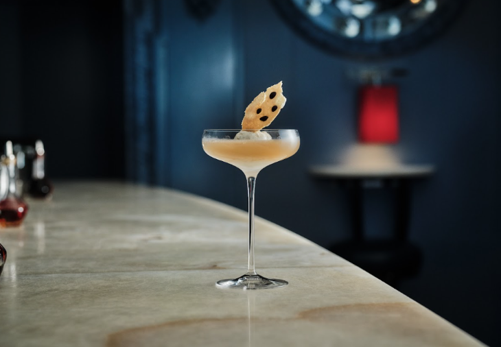 Things to do in London this autumn 2025: a cocktail with garnish on a bar