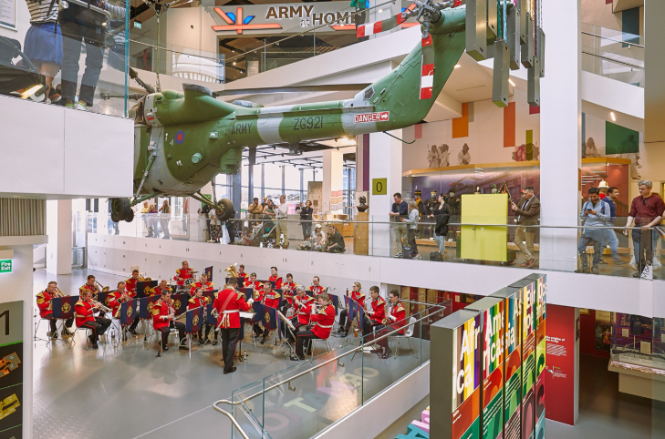 Chelsea History Festival 2025:  a military band performing beneath airplanes at the National Army Museum