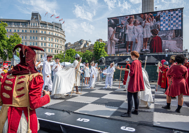 People forming a living chess set, in costume on a giant chess board in Trafalgar Square