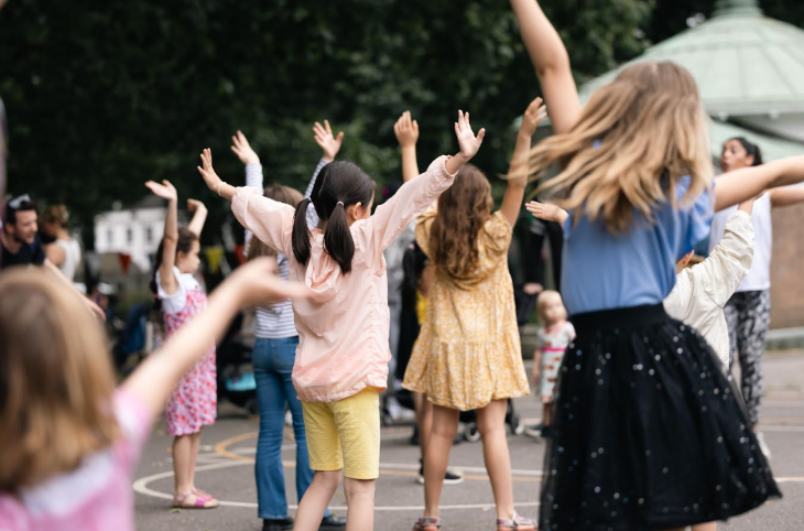Children dancing in the open air