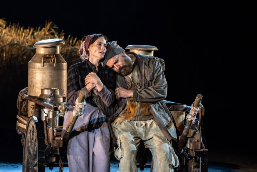 Things to do today in London: two performers from Fiddler on the Roof sitting on a cart on stage