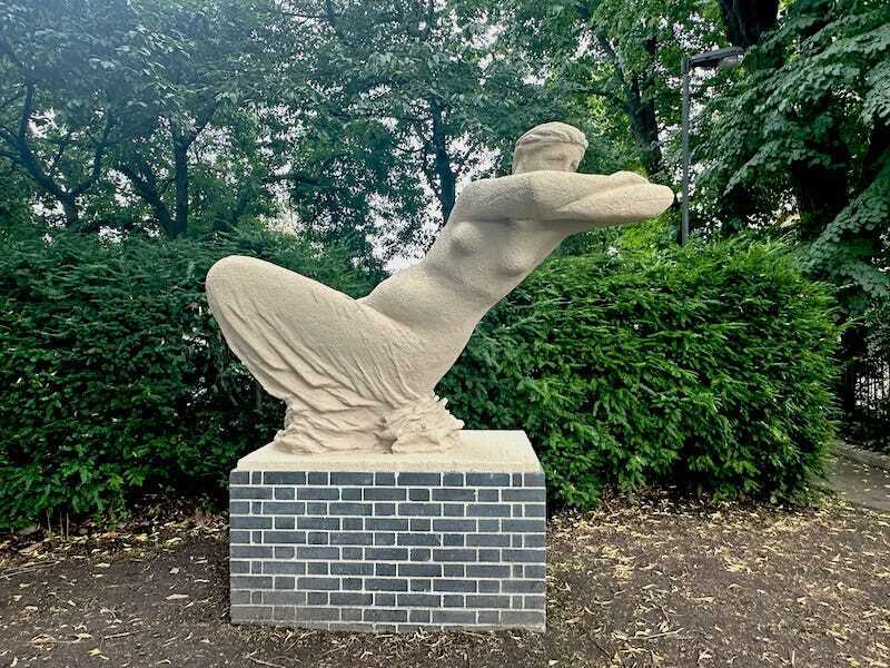 Sculpture of a leaning figure