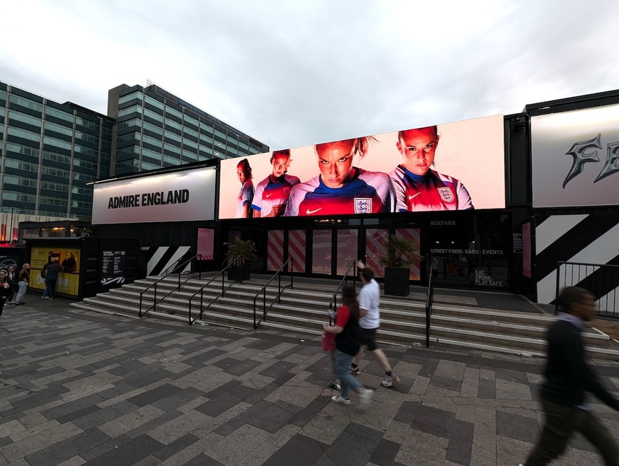 The Lionesses on a big screen outside Boxpark